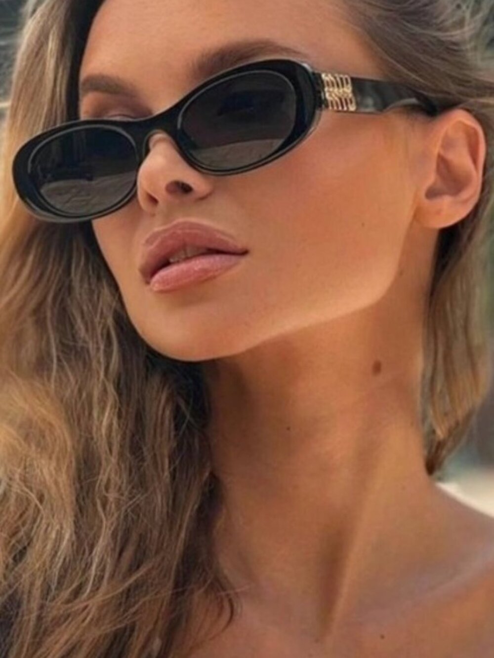 Miu Miu MU06ZS 1AB5S0 Sunglasses Black Oval Frame, Grey Lenses